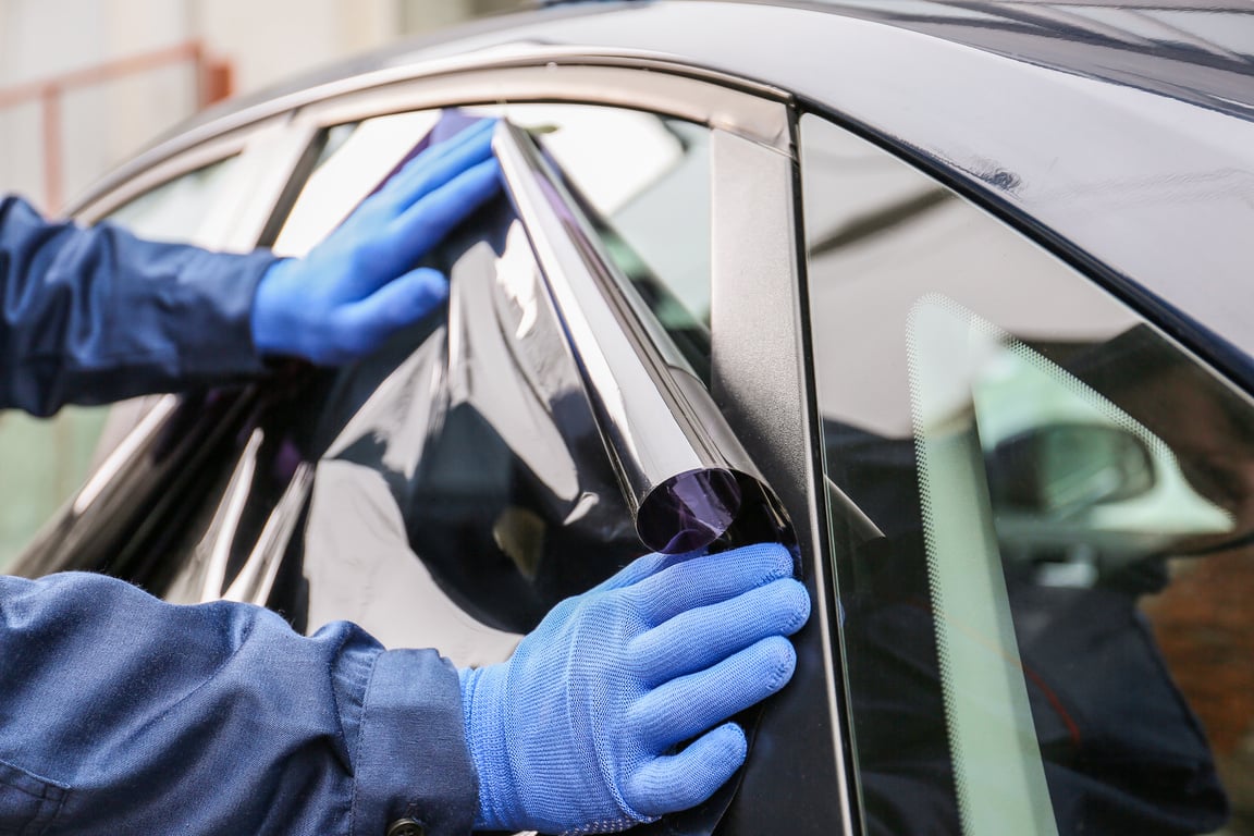 Male Worker Tinting Car Window